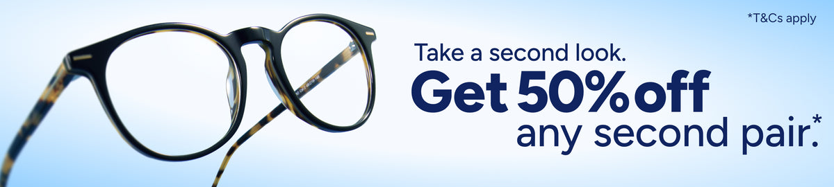 A pair of round eyeglasses with dark frames and tortoiseshell temples, shown against a light blue gradient background with promotional text reading 'Take a second look. Get 50% off any second pair.